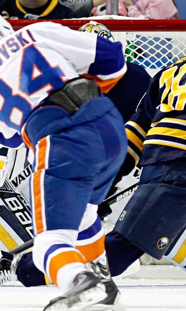 Short-handed Islanders defeat Sabres to take division lead